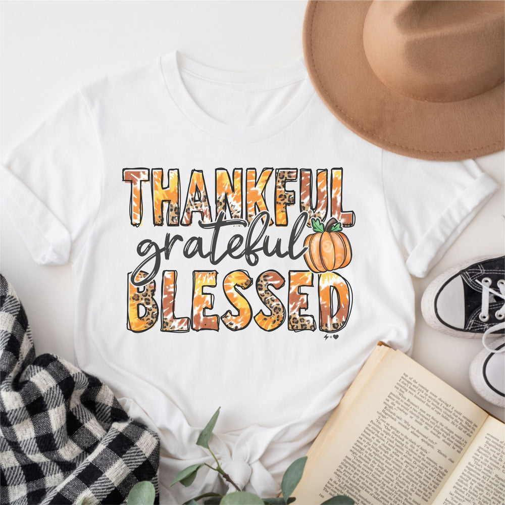 
            
                Load image into Gallery viewer, Thankful Grateful Blessed $12 Graphic Tee (TEE1092)
            
        